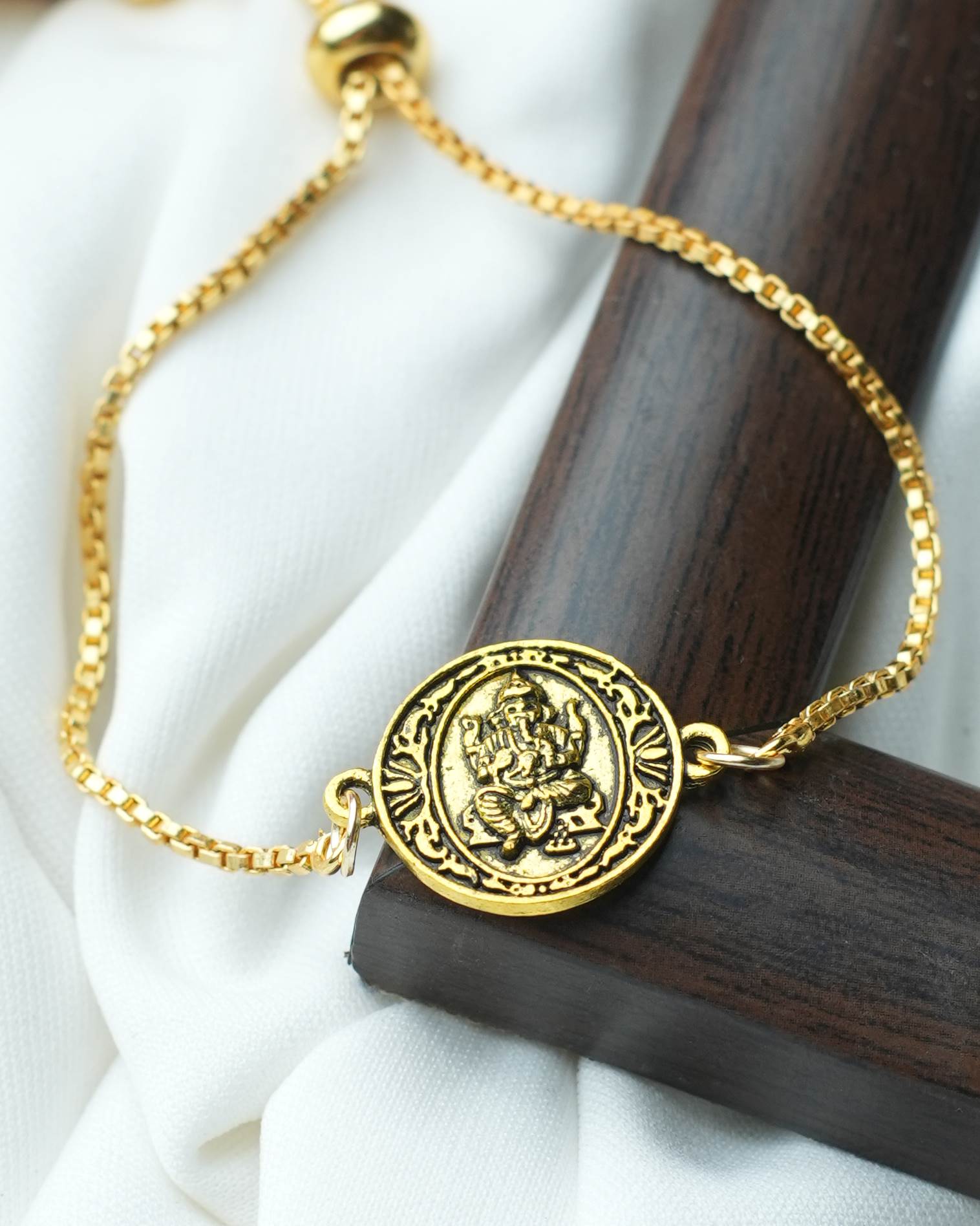 tatva-bracelet-gold-plated-bracelet-with-round-gold-oxidised-lord-ganesh
