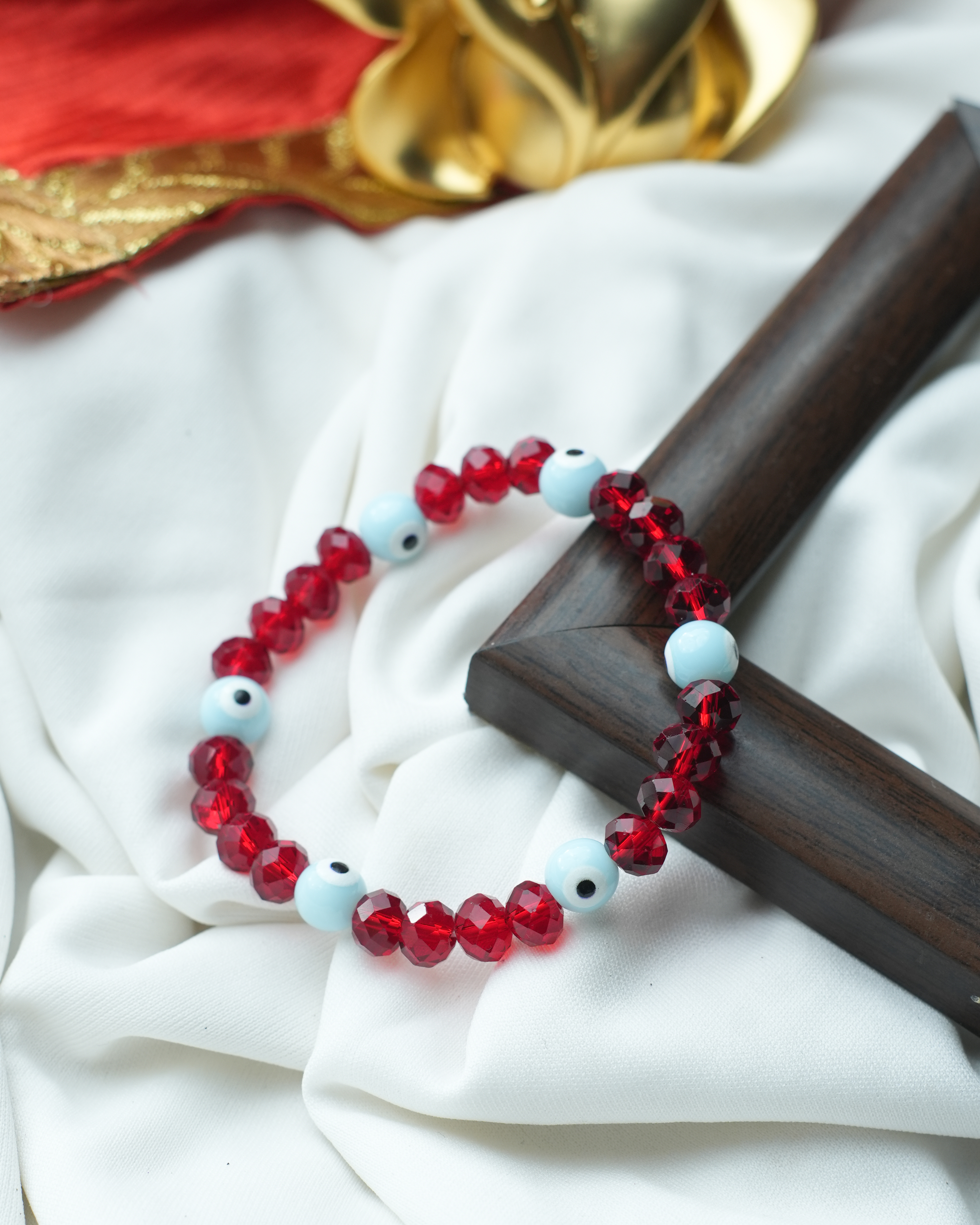 tatva-bracelet-|-red-crystal-and-blue-evil-eye-beads
