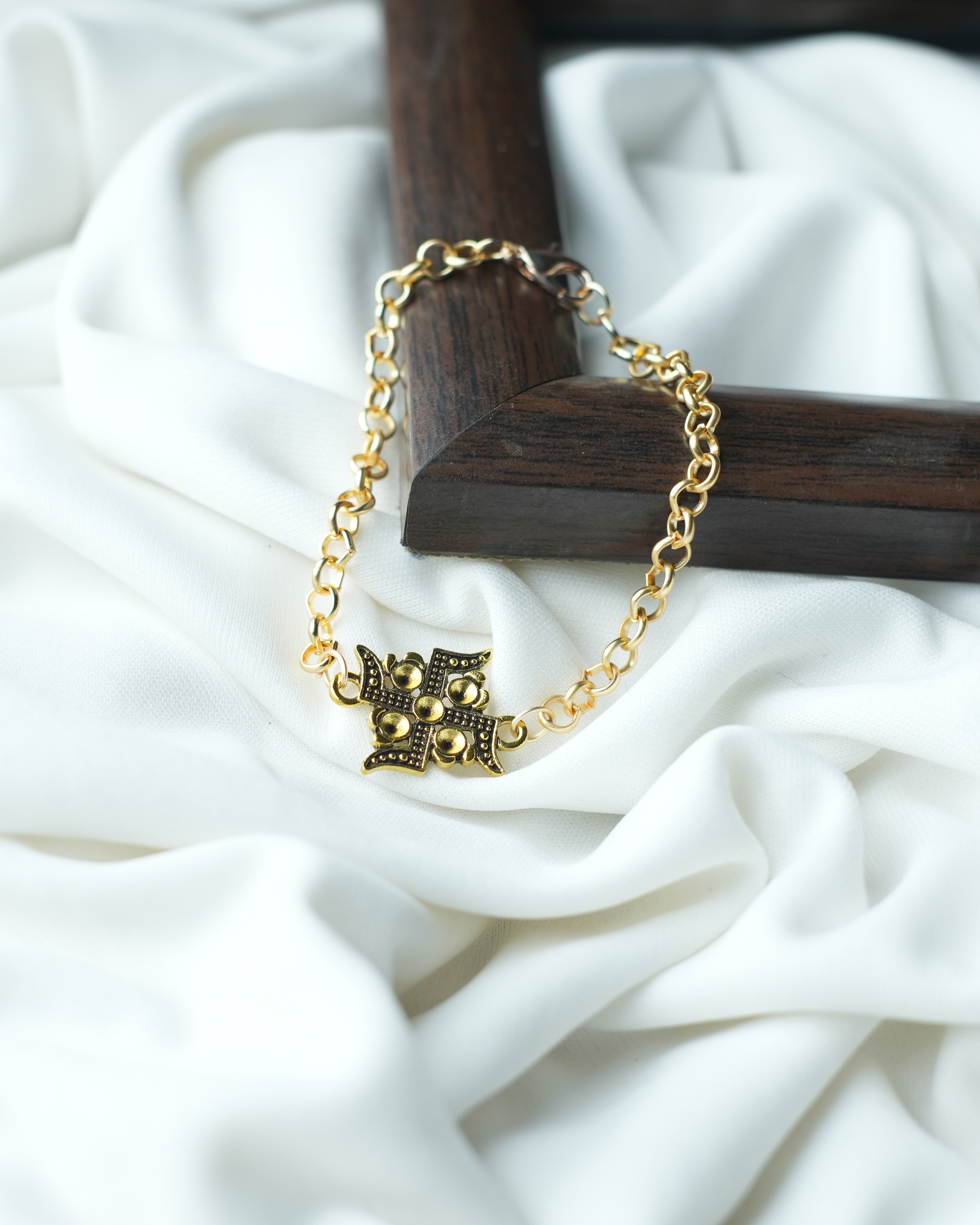 tatva-bracelet-|-golden-chain-with-gold-oxidised-swastik