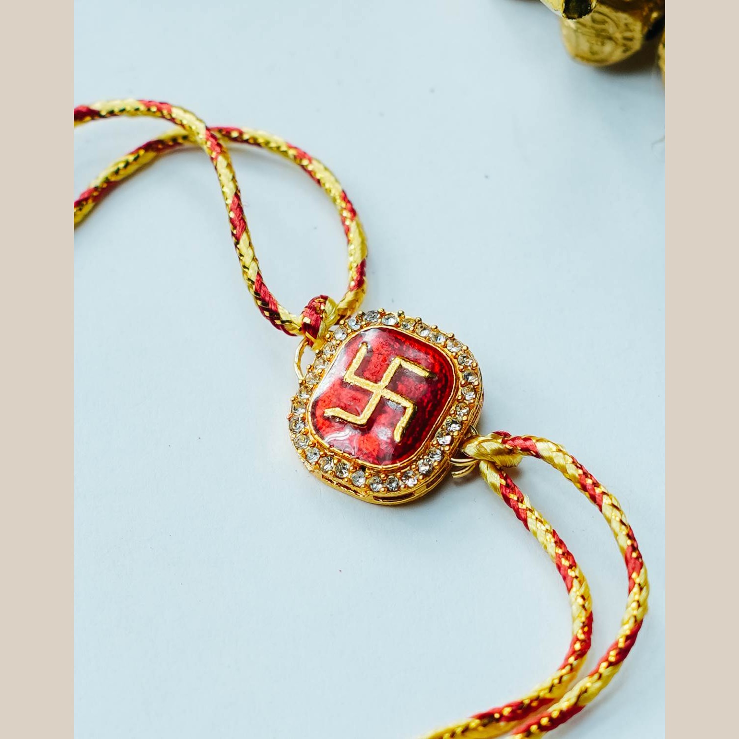 Gold And Silk Thread With Diamond Studded Swastik