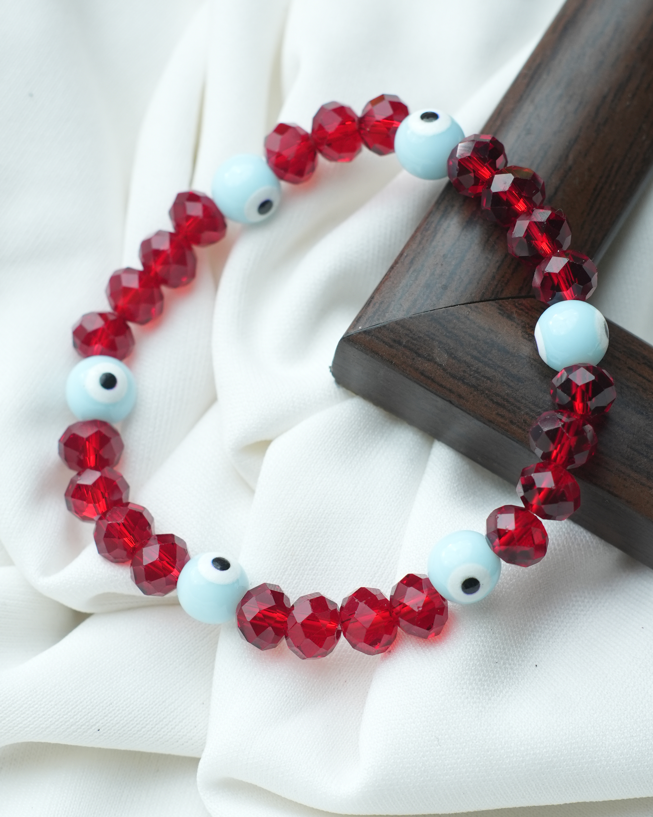 tatva-bracelet-|-red-crystal-and-blue-evil-eye-beads